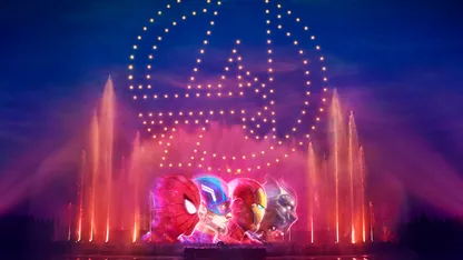 Disney World's Avengers Campus opening day with fireworks and water fountains in the background
