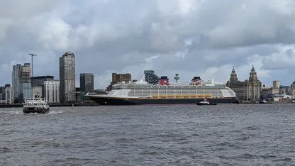 Cruise ship on the River Mersey, with Liverpool’s waterfront skyline and Royal Liver Building behind.