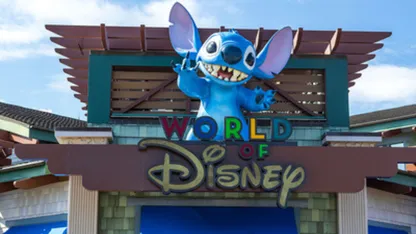 Entrance to World of Disney featuring Stitch above the shop sign.