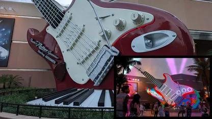 Oversized red-and-white electric guitar sculpture above piano keys, with an inset photo of a colourful guitar display.