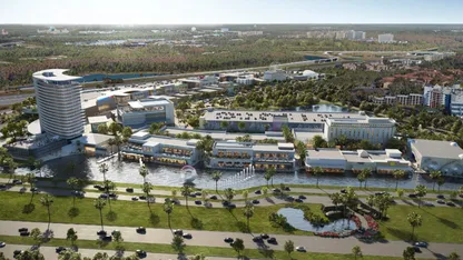 An aerial view of a large shopping mall with a river running through it