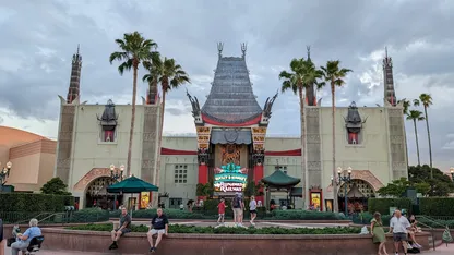 People walk around the entrance of the Mickey and Minnie's Runaway Railway at Disney World