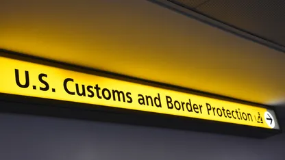 A yellow sign that says "U.S. Customs and Border Protection"