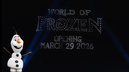 Olaf is standing in front of a screen that says "World of Frozen opening March 29 2026"