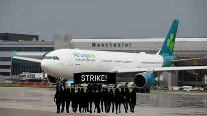 AerLingus airplane on the runway with STRIKE! sign in front of it