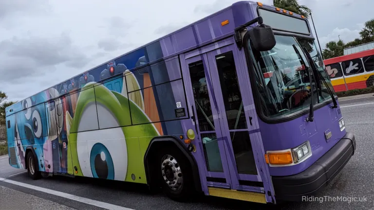 Purple city bus with cartoon character wrap on the side