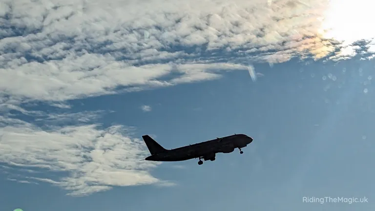 Aircraft approaching to land against a cloudy sky