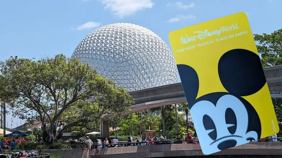 EPCOT’s geodesic sphere and a Walt Disney World sign featuring Mickey Mouse.
