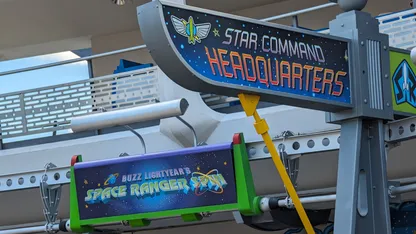Signage for Buzz Lightyear’s Space Ranger Spin and Star Command Headquarters.