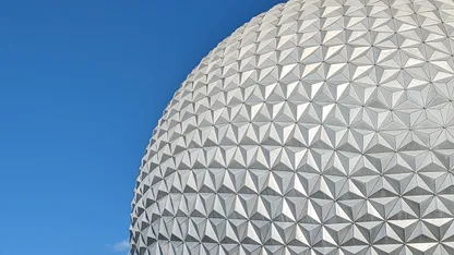 Close-up of Spaceship Earth’s geodesic dome at EPCOT against a clear blue sky.