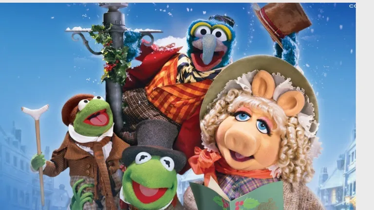 Muppet characters in winter attire pose together in the snow, including Kermit, Miss Piggy and a blue monster.