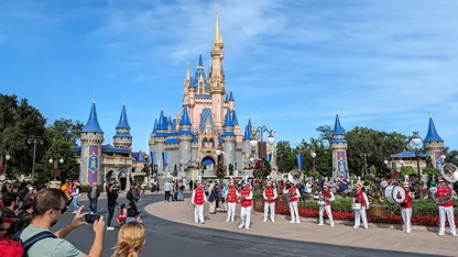 A marching band in front of Cinderella's Castle at Walt Disney World