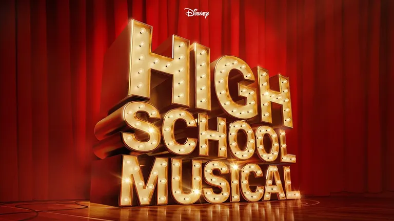 Disney High School Musical logo in illuminated gold lettering against red curtains.