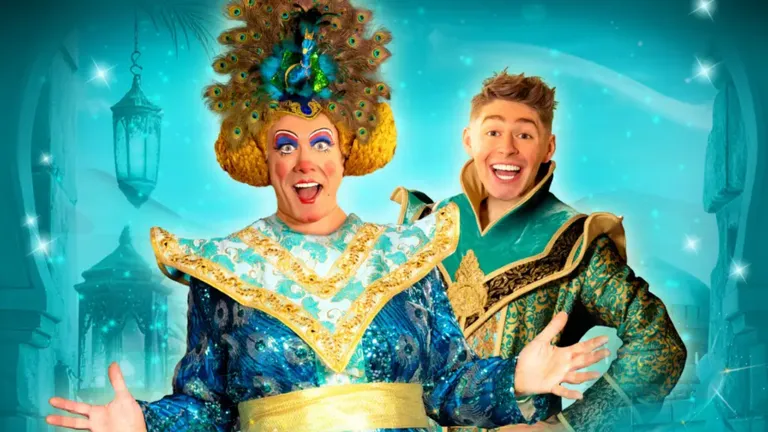 Costumed performers pose in ornate blue and gold outfits, with a peacock-feather headdress against a turquoise fantasy backdrop.
