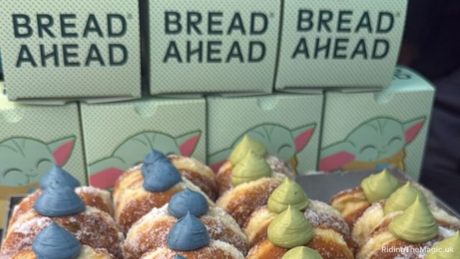 A display of bread ahead pastries with blue and green frosting