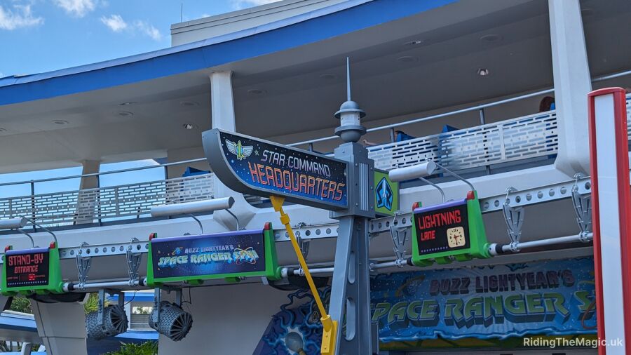 Buzz Lightyear's Space Ranger Spin entrance and Lightning Lane signs at Disney World
