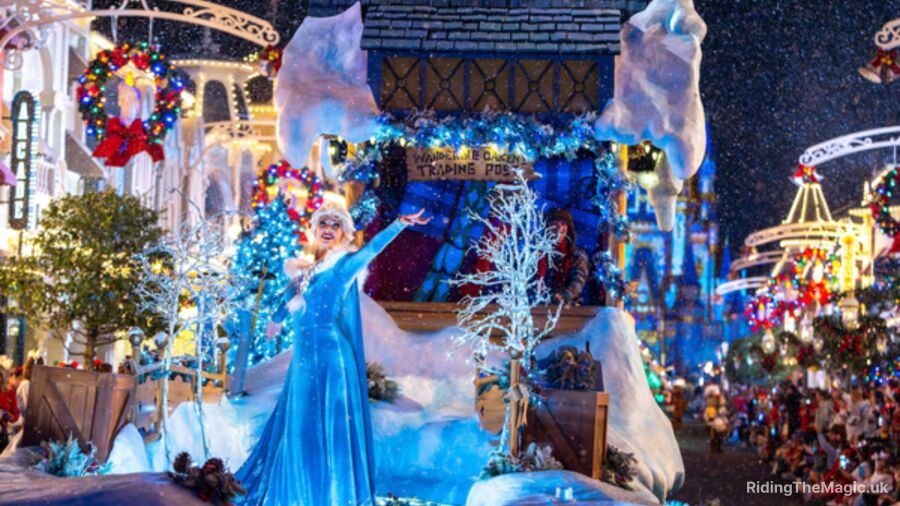 A Christmas parade float with a woman in a blue dress and a Christmas tree