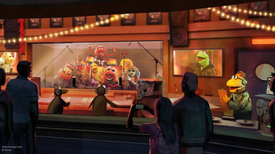 The Muppets are on stage in front of a crowd in a recording studio