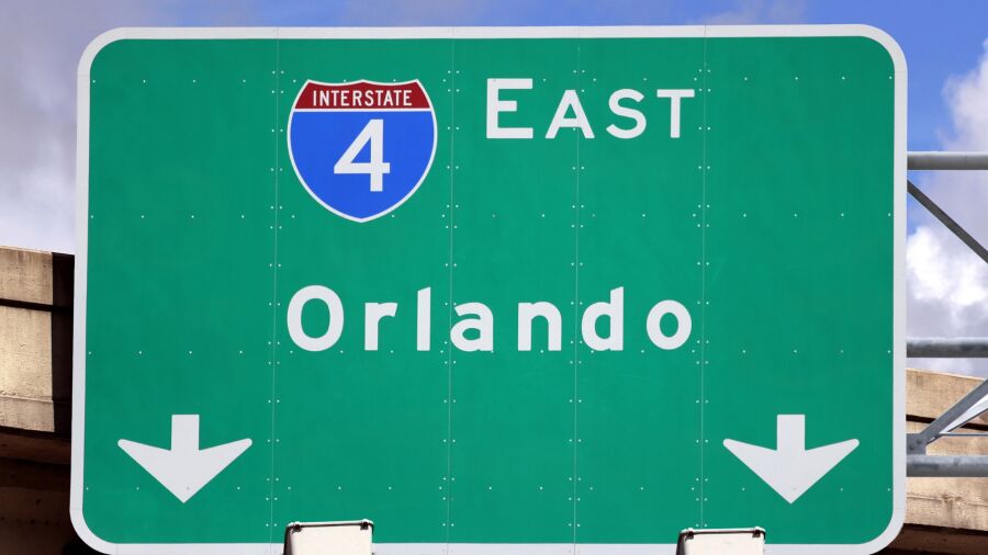 green road sign saying Orlando