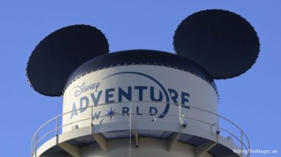 A water tower with Mickey Mouse ears and the words Disney Adventure World