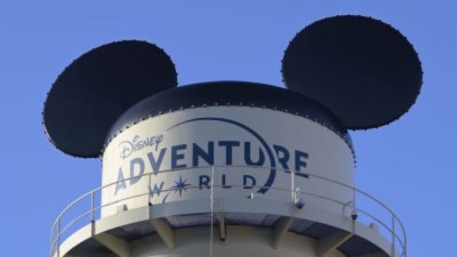 A water tower with Mickey Mouse ears and the words Disney Adventure World