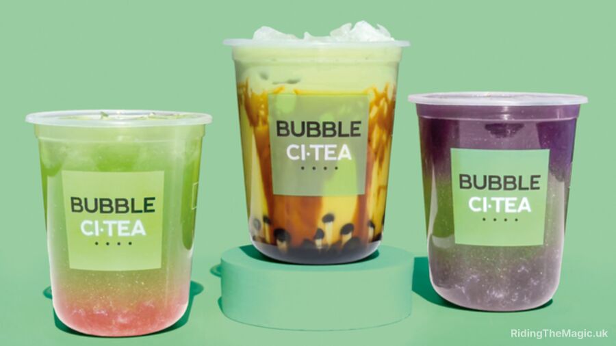 Three bubble teas on a green background, each with a different flavor and color