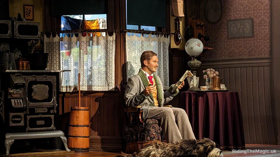 A man sitting in a chair in a room with a dog