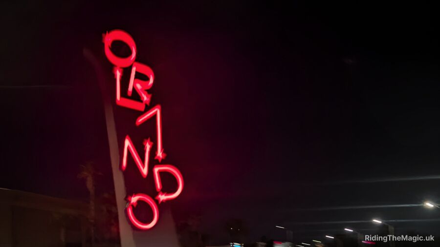 A neon sign for the Ormond Hotel is lit up at night