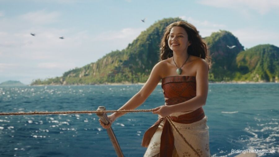 Moana standing on a boat holding a rope with a smile on her face