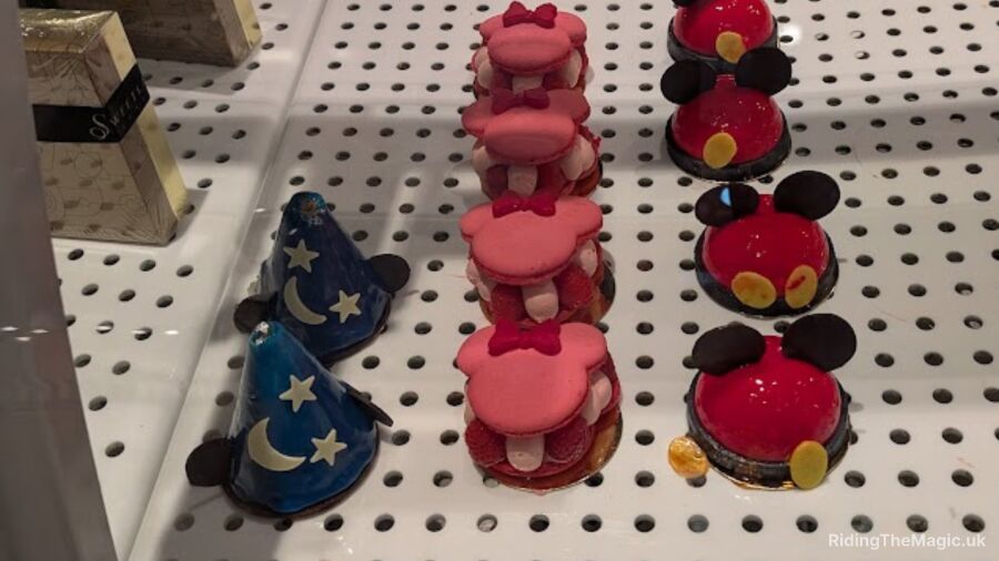 A display of Mickey and Minnie Mouse themed desserts at a store