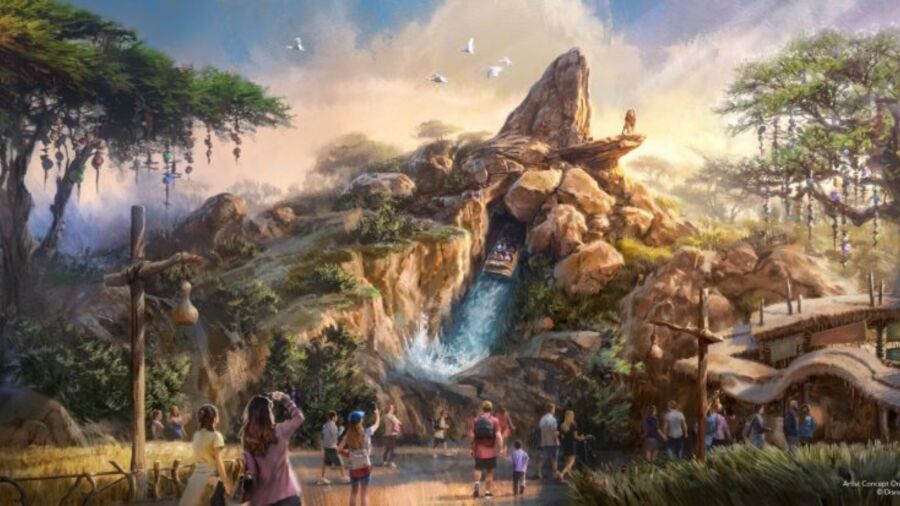 A crowd of people are walking around a waterfall in a jungle
