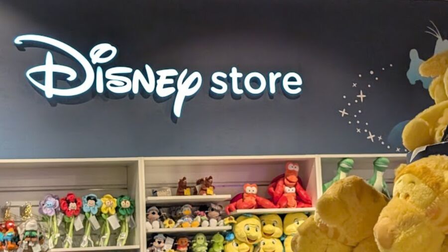 Disney Store with shelves of toys and a sign that says Disney Store