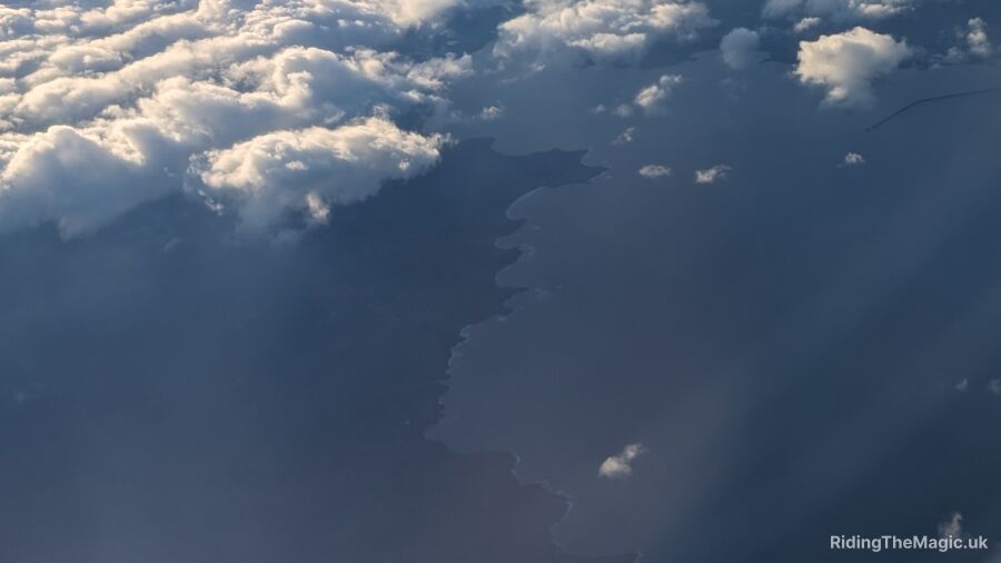 Aerial view of clouds over the ocean and land