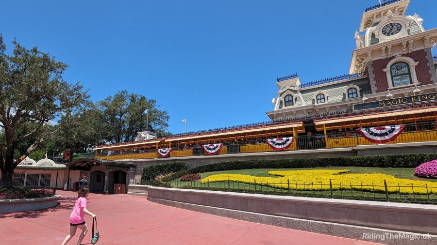 A girl walks through the entrance of Magic Kingdom in Florida