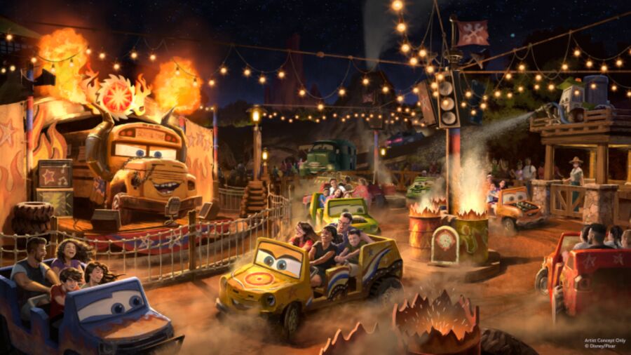 Cars Land at Disney California Adventure Park with people riding on cars and fires