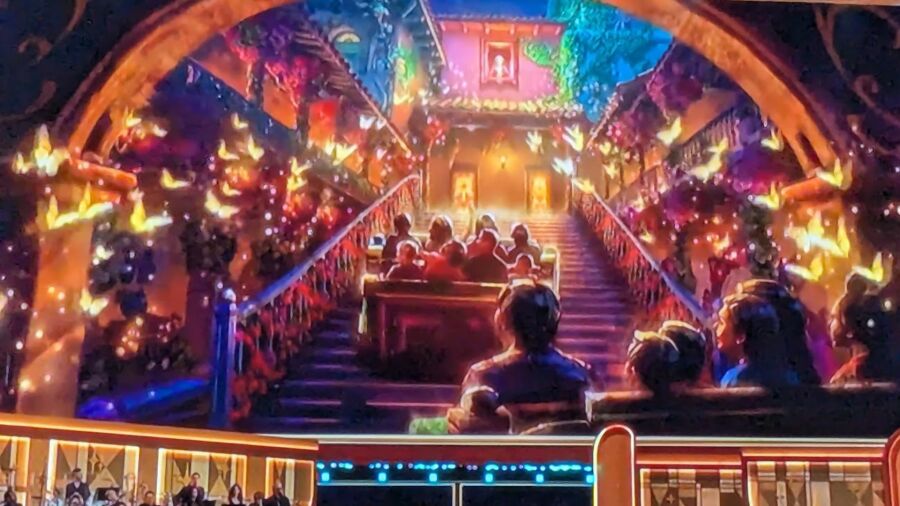 A picture of a ride in a Disney park with a Christmas theme
