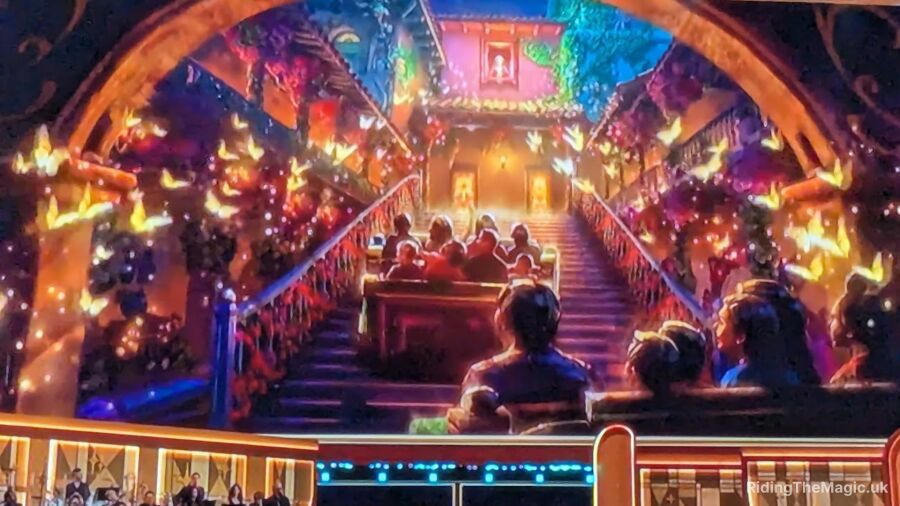 A picture of a ride in a Disney park with a Christmas theme