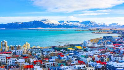 Reykjavik, Iceland, with colorful buildings and mountains in the background