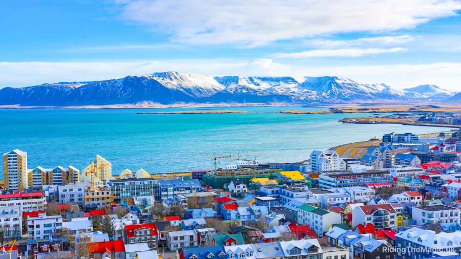 Reykjavik, Iceland, with colorful buildings and mountains in the background