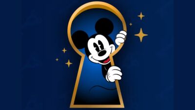 Mickey Mouse is peeking out of a keyhole on a blue background