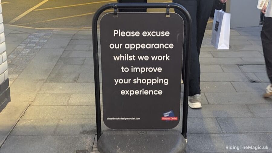 A sign on the sidewalk that says, 