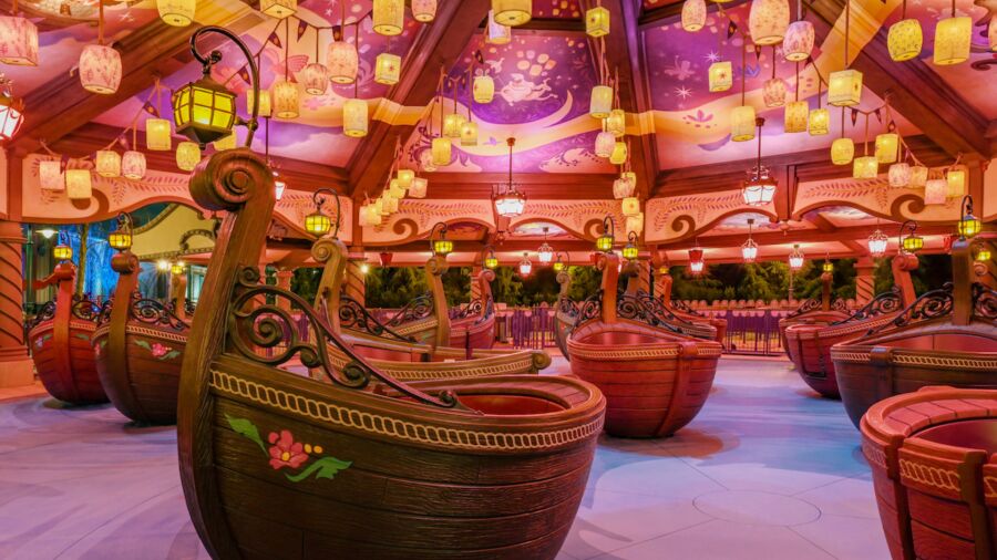 A carousel ride at Disney World featuring boats as seats and a whimsical atmosphere