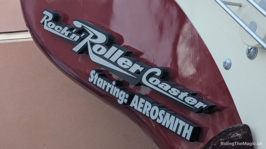 Rockin' Roller Coaster Starring Aerosmith sign on the side of a building